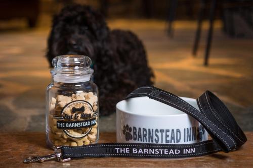 a mason jar with a keychain next to a mug at The Barnstead Inn in Manchester Center