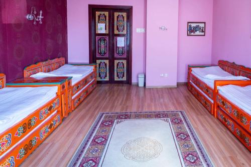 Ein Bett oder Betten in einem Zimmer der Unterkunft Lotus Guesthouse