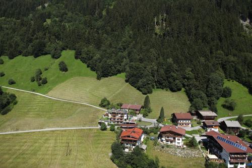 an aerial view of a house on a hill at Haus am Sonnenhang in Finkenberg