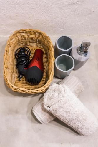 a basket with a bird on it next to other items at Fisheye The Rooms - Room 1 in El Nido