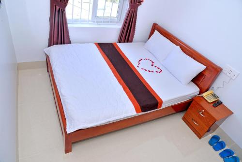 Postel nebo postele na pokoji v ubytování Sevensea Vung Tau