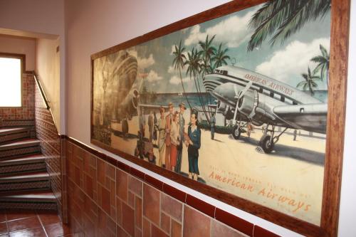 a large picture of an airplane on the wall at Beatriz Charming Hostal in Torremolinos