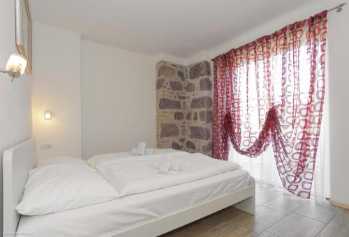 Postel nebo postele na pokoji v ubytování Apartment Residence Veronika