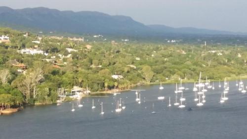 an aerial view of a lake with boats and a town at Letamong in Hartbeespoort