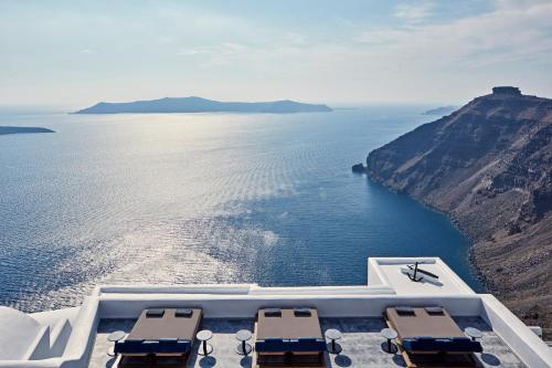 a view of the ocean from a hotel balcony at Homeric Poems in Fira
