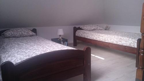 Uma cama ou camas num quarto em Michałowice Noclegi u Anety