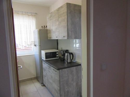 Η κουζίνα ή μικρή κουζίνα στο Apartment Diklic
