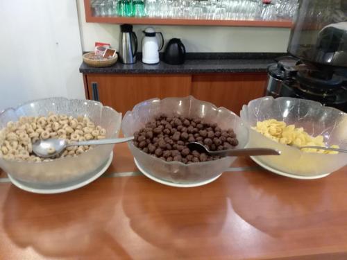 three bowls of food sitting on a counter at Villa A. Malka in Poděbrady