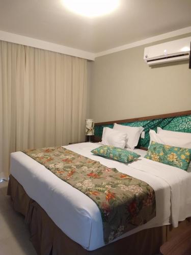เตียงในห้องที่ Malai Manso Cotista - Resort Acomodações 4 hosp