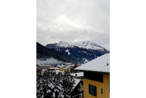 a view of a mountain with snow on it at Pension Charlotte in Bad Gastein