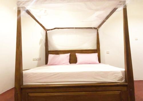 Кровать или кровати в номере Cinnamon House