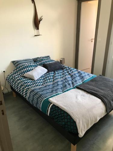 Un pat sau paturi într-o cameră la 26 avenue des Tilleuls