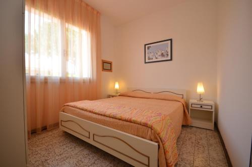 En eller flere senge i et værelse på Villaggio Michelangelo - Lemene