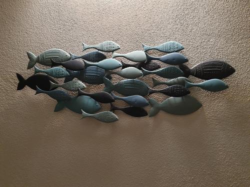 a group of fish on the side of a wall at B&B ALDA in Levanto