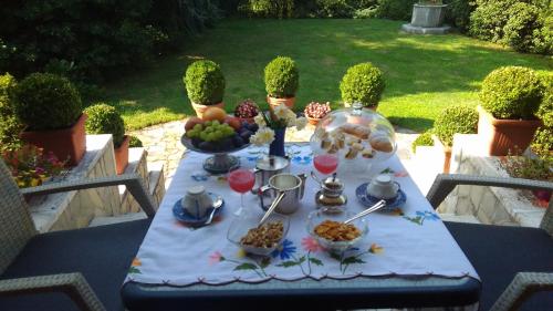 a table with food on top of it at B&B La Villa Mediterranea in Passirano