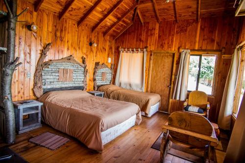 Postel nebo postele na pokoji v ubytování Apart hotel Puchaley Lafquen
