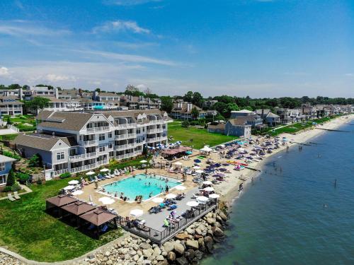 an aerial view of a resort with a pool and beach at Water's Edge Resort & Spa in Westbrook