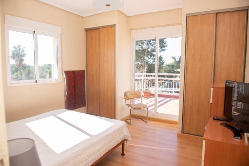 Ένα ή περισσότερα κρεβάτια σε δωμάτιο στο Villa Rive Rouge