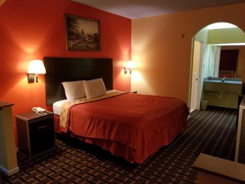 Postel nebo postele na pokoji v ubytování Texan Inn & Suites