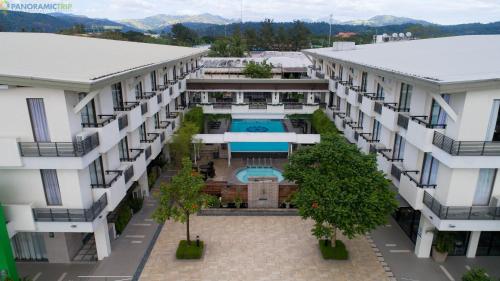 an aerial view of an apartment building with a swimming pool at Mansion Garden Hotel in Olongapo