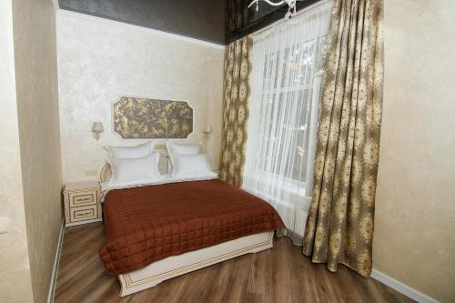 Кровать или кровати в номере Safari-Club