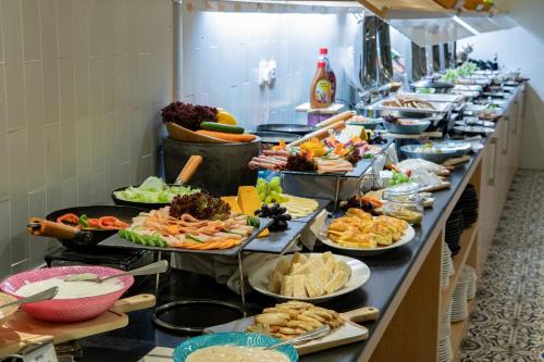 a buffet line with many plates of food at Park Inn by Radisson Jubail Industrial City in Al Jubail