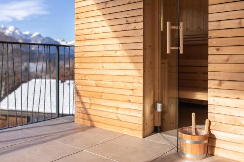 a balcony with a view of the mountains at Lake Resort Pressegger See in Hermagor
