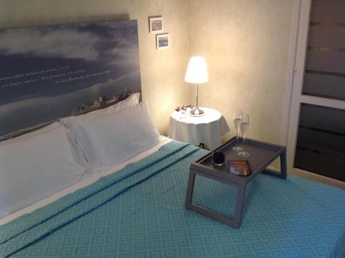 Postel nebo postele na pokoji v ubytování Mare Nostrum Petit Hôtel