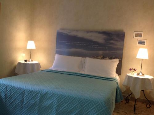 Postel nebo postele na pokoji v ubytování Mare Nostrum Petit Hôtel