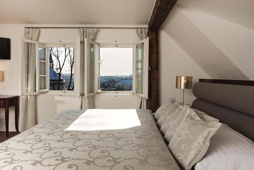 
Ein Bett oder Betten in einem Zimmer der Unterkunft Hoffmeister&Spa Depandance
