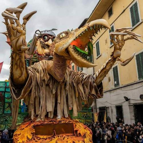a dragon float in a parade with a crowd at Tuscany Experience BnB in Foiano della Chiana