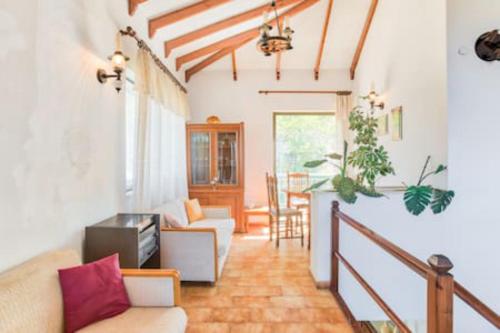 a living room with a couch and a table at Marmari View in Marmarion