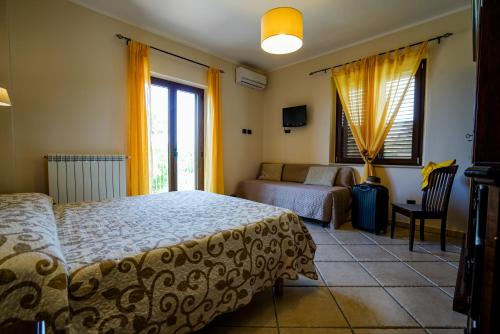 Postel nebo postele na pokoji v ubytování Villa D'Aquino