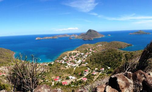 an aerial view of the islands in the ocean at Coco D'Iles in Terre-de-Bas