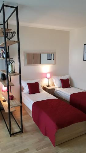 Ένα ή περισσότερα κρεβάτια σε δωμάτιο στο Girelės apartamentai