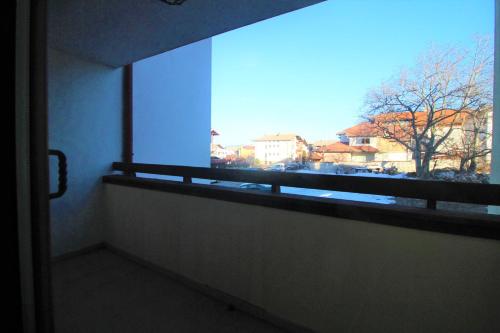 a window in a room with a view of a city at Mountview Lodge Apartments in Bansko