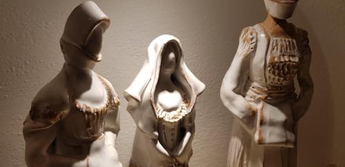 two mannequins and two mannequins in a room at Sa Branda Costa Country Alghero in Santa Maria la Palma