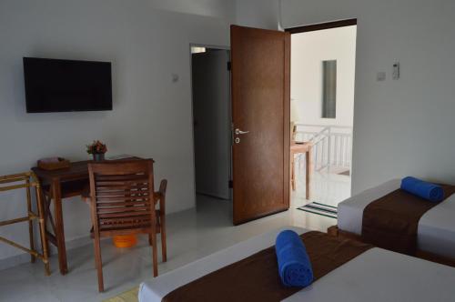 Katil atau katil-katil dalam bilik di Askara Guest House & Hostel
