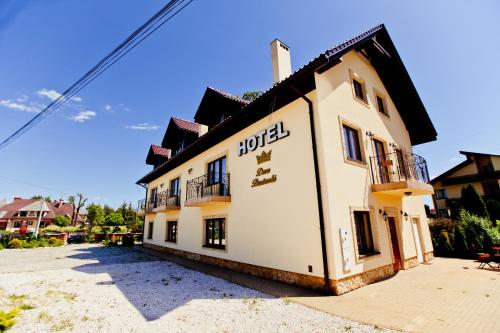 a building with a hotel sign on the side of it at Dwa Bratanki in Rzeszów