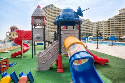 a playground with many different types of play equipment at Chalet in Pyramids Porto Sokhna in Ain Sokhna