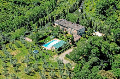 an aerial view of a house with a swimming pool at Agriturismo Filettro in Volterra