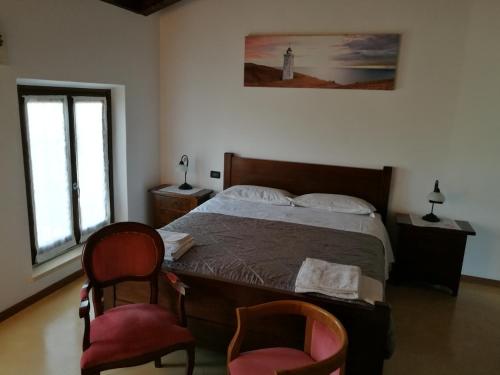 Postel nebo postele na pokoji v ubytování B&B L'Upupa