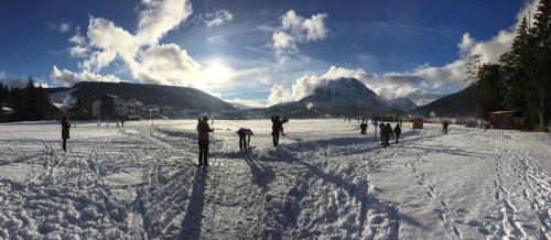a group of people on skis in the snow at Karwendel Apartments in Scharnitz