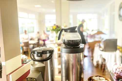 a coffee machine sitting on a counter in a restaurant at Cliff Top Apartment 3 Bedroom in Shanklin