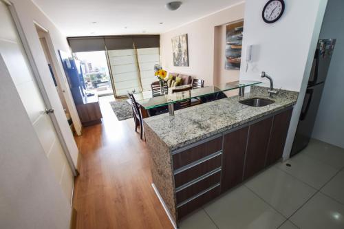 a kitchen with a sink and a counter top at Miraflores Apartments 570 Pardo Ave by Private Host in Lima