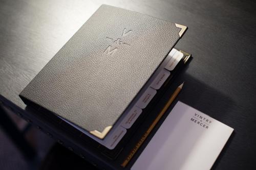 two books sitting on a table with a remote control at Vintry & Mercer Hotel - Small Luxury Hotels of the World in London