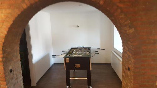 a chess table in a room with an archway at Feierabend Elsdorf in Elsdorf