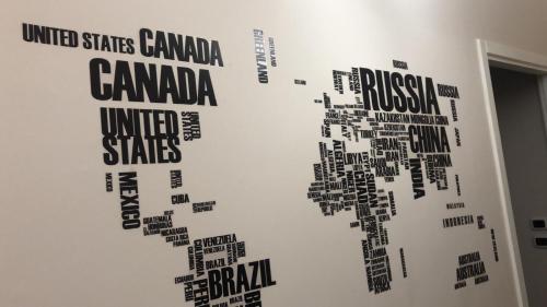 a wall with a map of the world at Holidays Lecce in Lecce