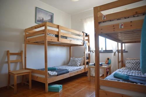 Postel nebo postele na pokoji v ubytování Surf House Peniche