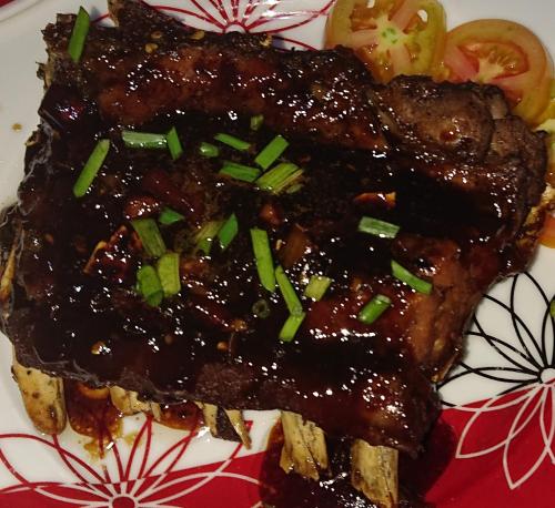 a plate of food with meat and vegetables on it at Prince Transient house in San Jose